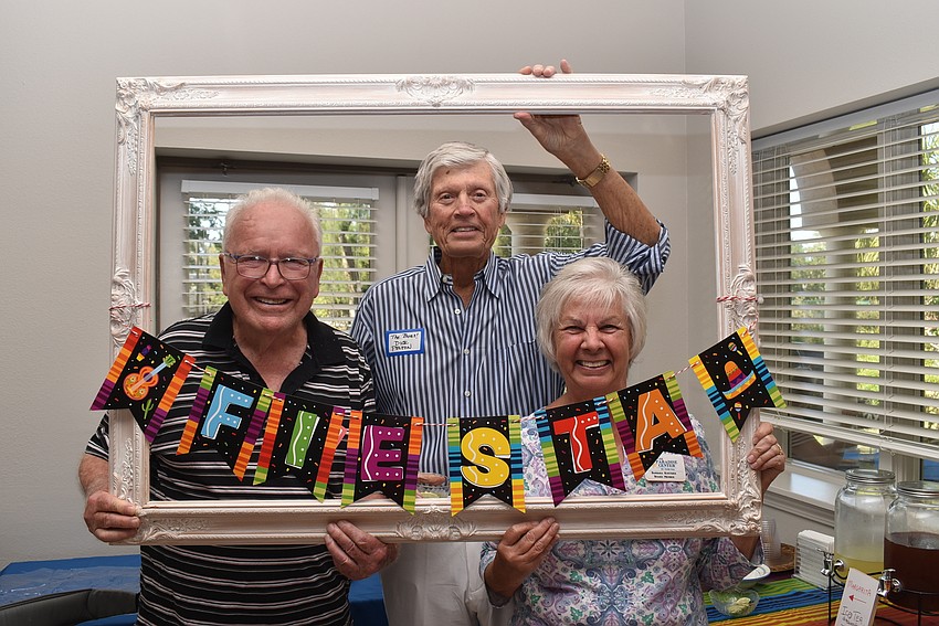 John Brill, board president Dick Pelton and board member Barbara Koetsier pose for the fiesta.