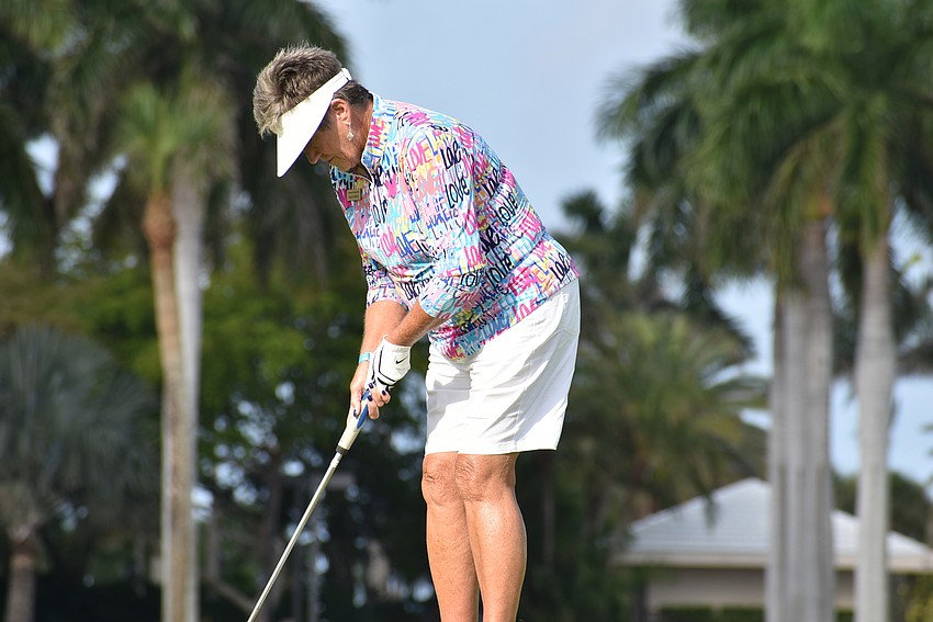 Fran Stock prepares to putt.