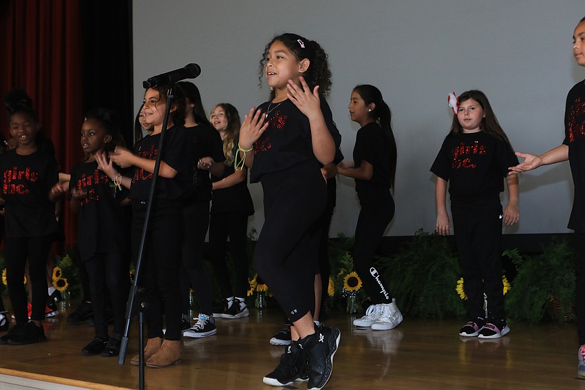 The program started with singing from the Girls Inc. choir.