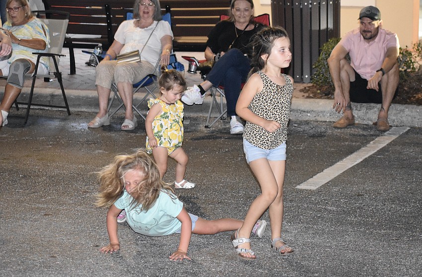 Willowbrook's Allie Selvog, 5, and Woodleaf Hammock's Ellie Hoover, 1, and Ava Hoover, 5, show off their dance moves.