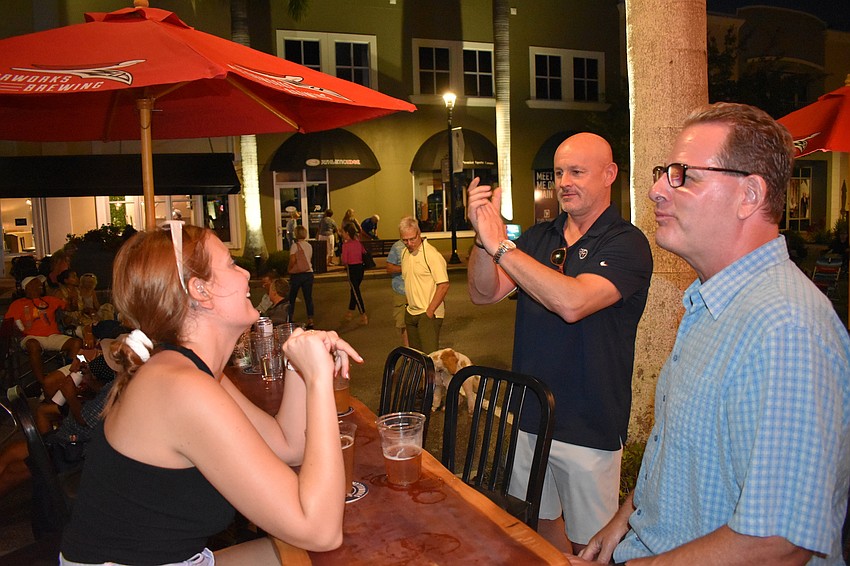 Victoria Eaton and Donny Rumsby, who have just moved to Lakewood Ranch, get a tour of Music on Main from their realtor, Dan Bacon.