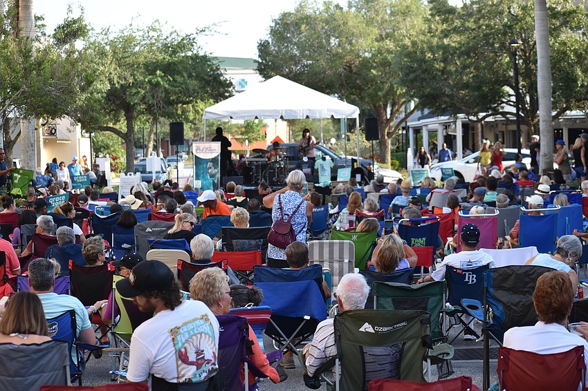 The audience fills out Main Street as the music begins.