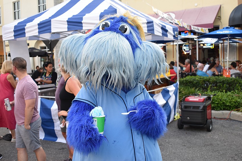 Raymond, representing the Tampa Bay Rays, enjoys a Kona Ice snow cone in his favorite color.