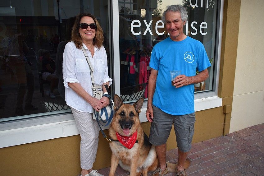 Lenore Boccia, Robert Boccia, and their dog Remo of Country Club East enjoy the atmosphere. The couple say the event is one of Remo's favorite activities, and that he loves the bacon at Craft Growlers To Go & Tasting Room.