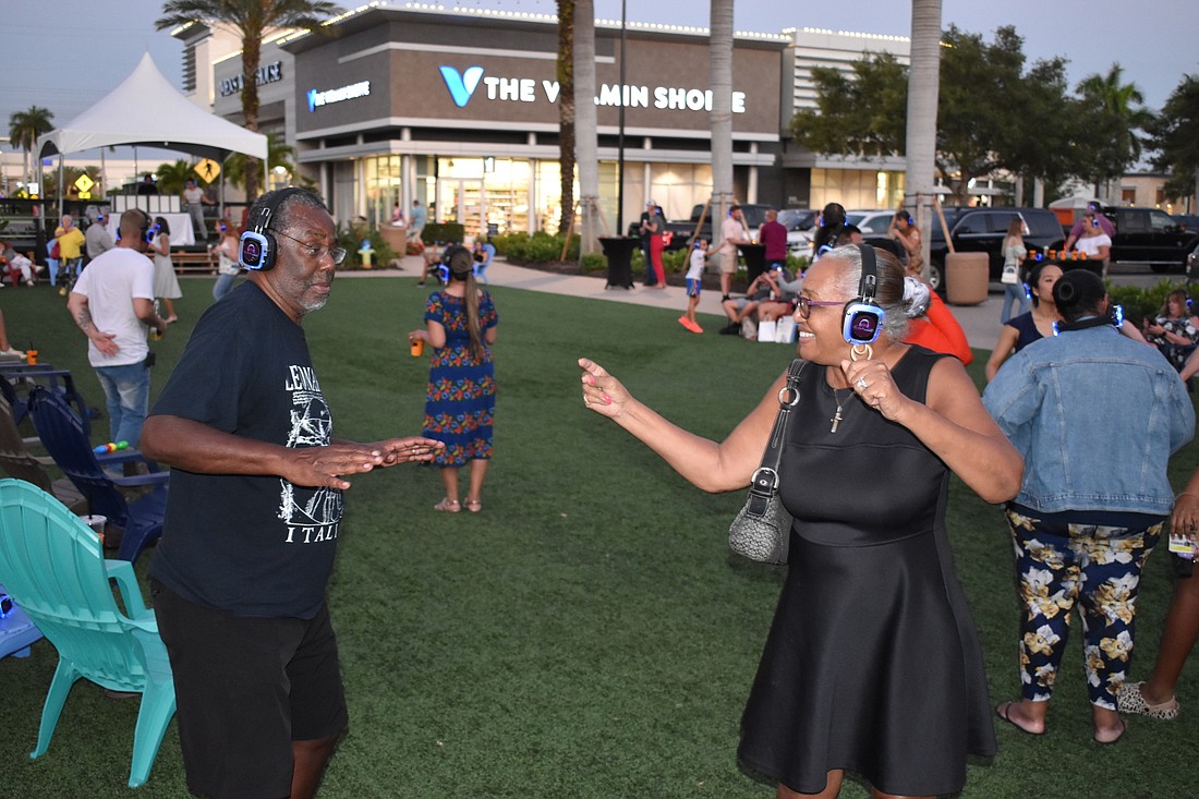 Dewitt Scott and Joan Scott of Lakewood Ranch are energized by the music.