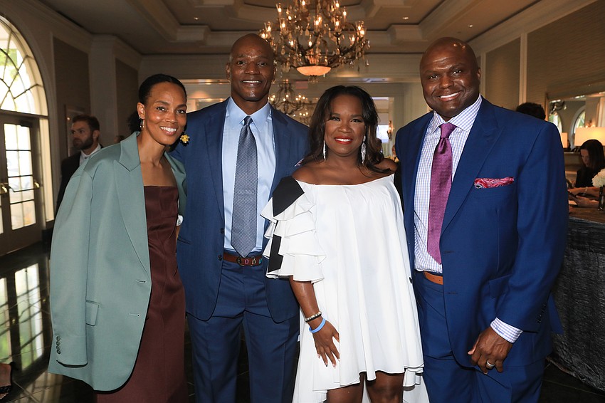 Kristin and Bryant Young with Tommy and Anthony McFarland