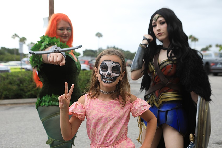 Elaina Albury poses with Poison Ivy and Wonder Woman