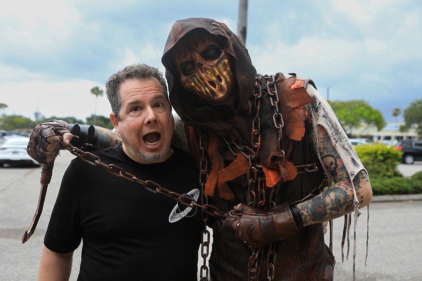 Dark Side owner Brian Polizzi takes a moment with the Scarecrow