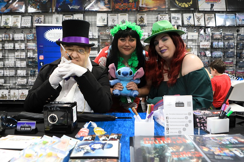 Joseph and Heidi Vabrik run the Gotham Underground table with Jessie Long