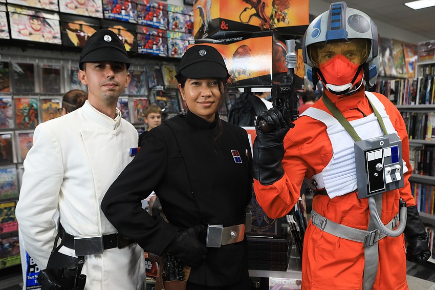 Caleb and Heidi Brethauer and Vincent Nolan with the 501st and Rebel Legion