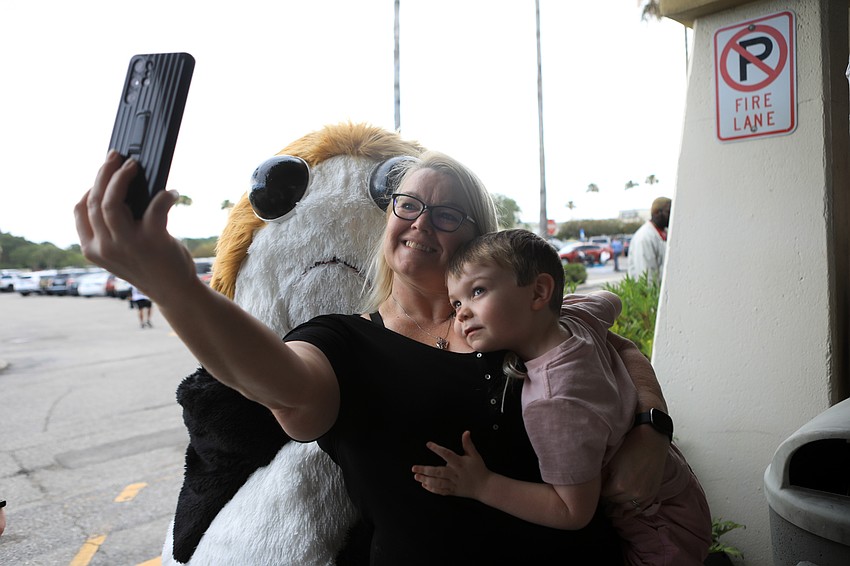Mary and KC Haley pose with a porg.