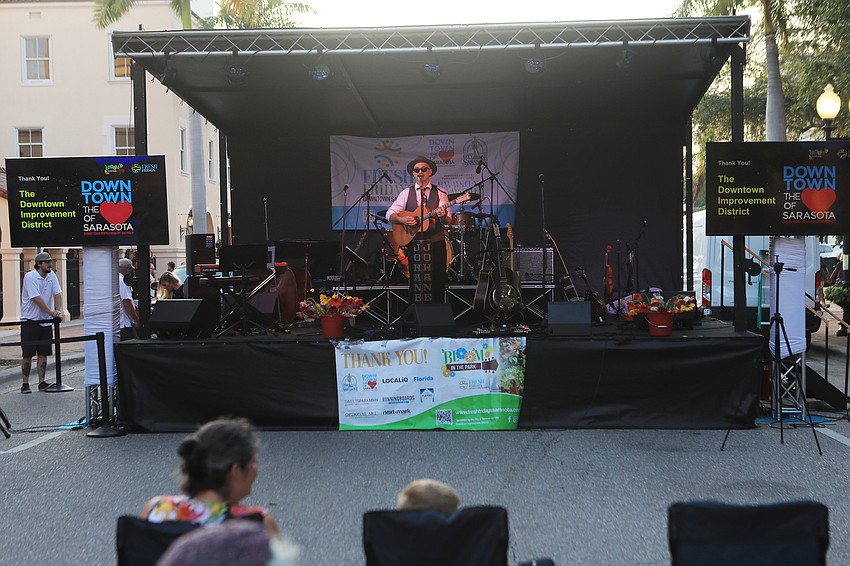 The crowd listen to all sorts of folk music.