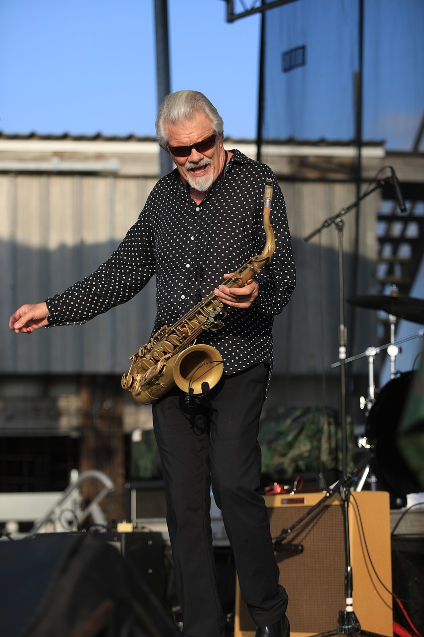 Members of the Doug Deming and the Jewel Tones play to the crowd.