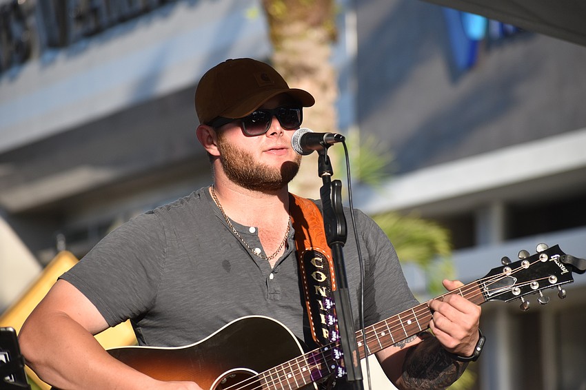 Conyer Walker sets the ambiance with live acoustic guitar music.