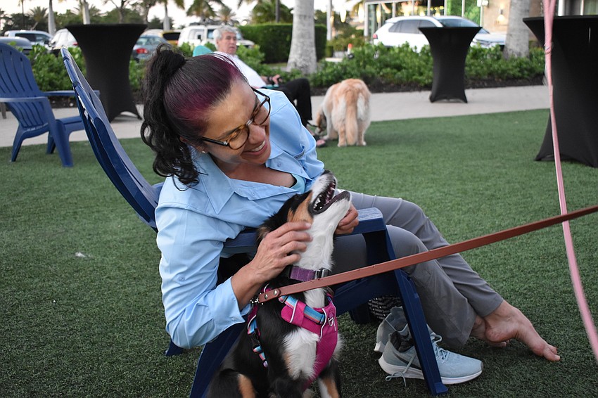 Lakewood Ranch resident Cynthia Friedman pets a mini Aussie, Willow.