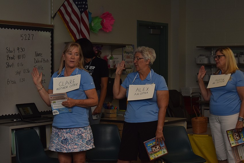 Susan McGuire, Susan Veshosky and Ellen Greenberger recite the water safety pledge.