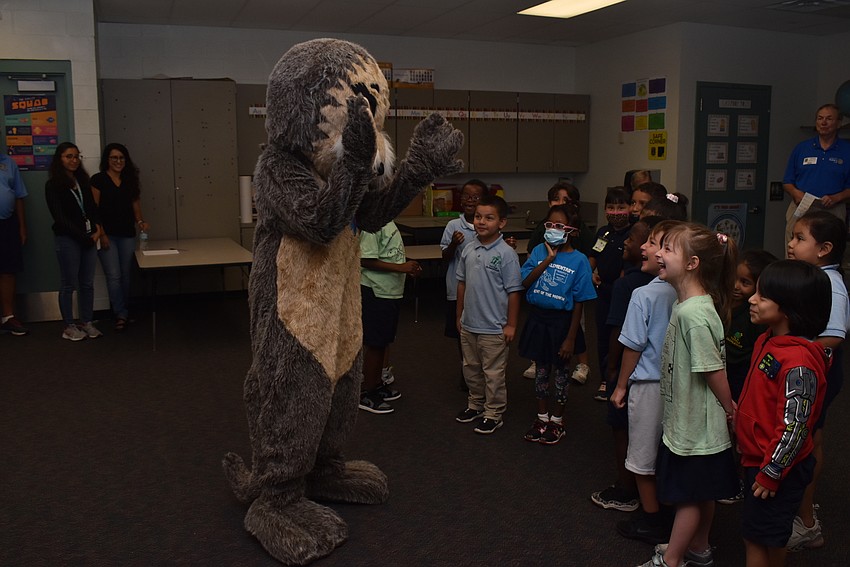 Josh the Otter makes a splashy entrance.