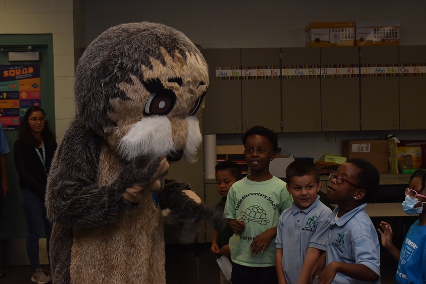 Kids clamor to get closer to Josh the Otter.