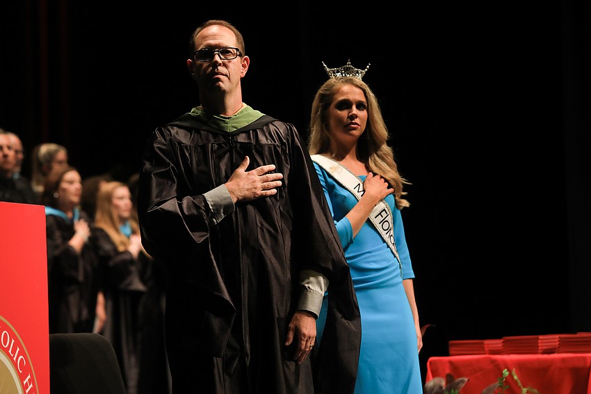 Stefan Gates and Leah Roddenberry pledge allegiance.