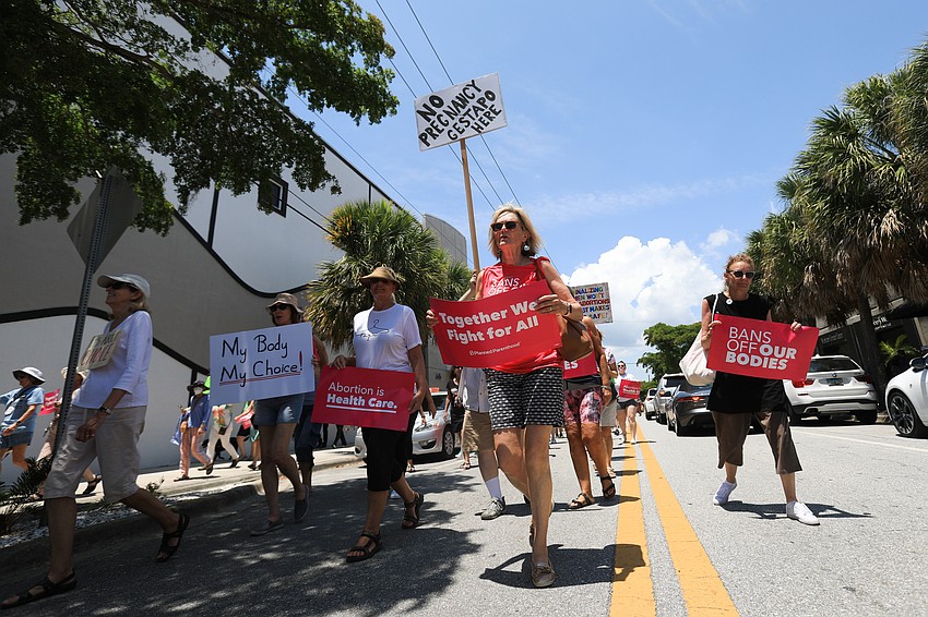 Hundreds marched through the Rosemary District.