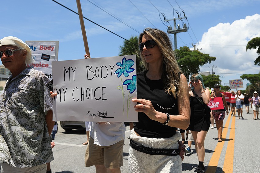 Lissa Murphy marches with the crowd.