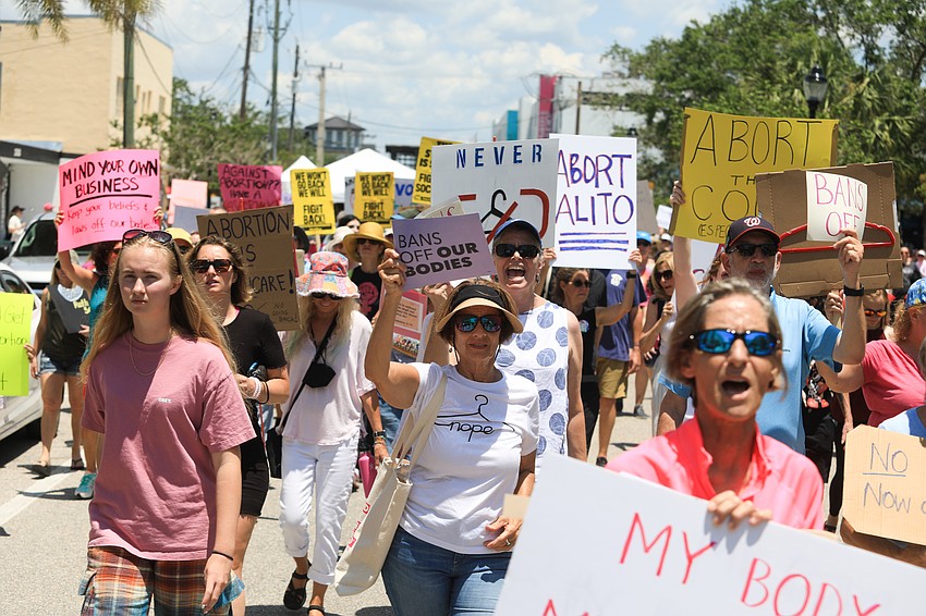 Hundreds marched through the Rosemary District.