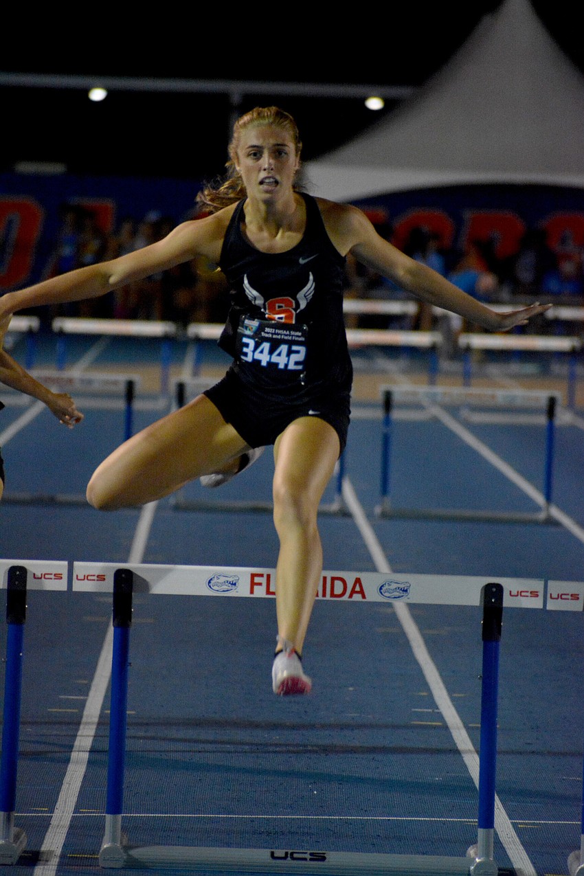 Sarasota High junior Isabella Nebel leaps during the Class 4A girls 300 meter hurdles at the FHSAA state championships. Nebel finished fifth (44.35 seconds).