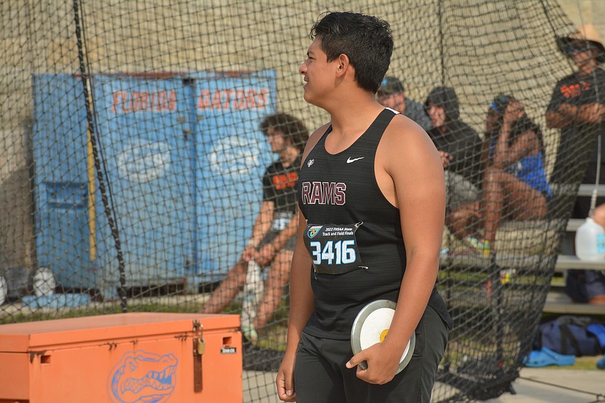 Riverview High sophomore Luis Castaneda watches the competition during the FHSAA Class 4A boys discus. Castaneda finished 12th (141 feet, three inches).
