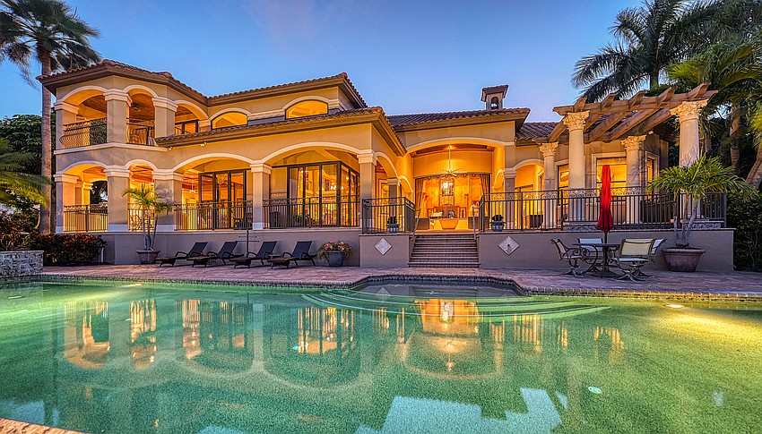The back yard pool measures 65  feet long.
