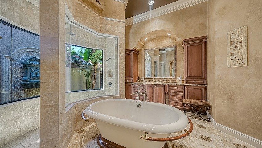 The master suite, with a luxurious bathroom, is on the first floor.