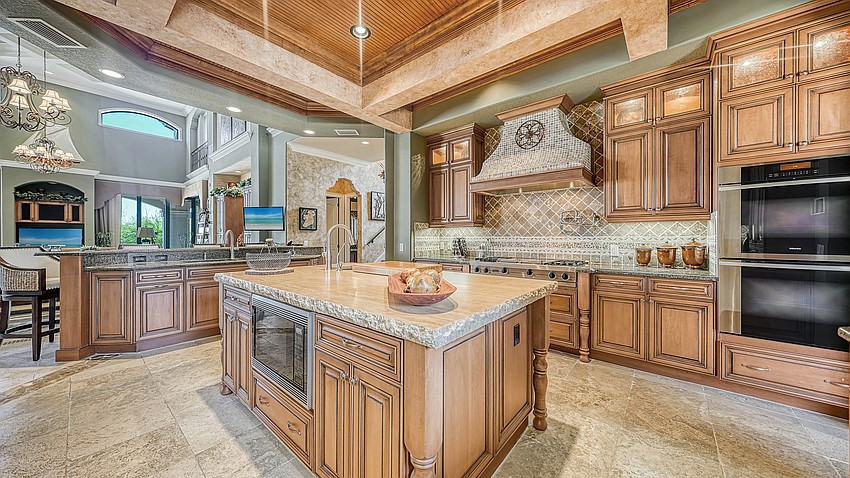 Granite and custom cabinetry throughout the kitchen.