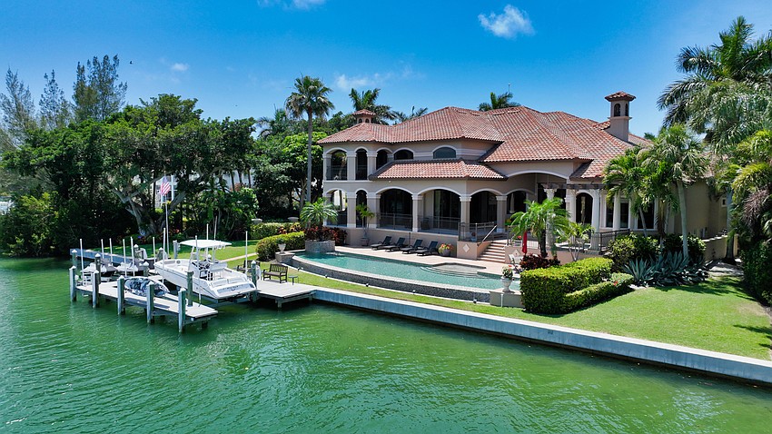 The property includes 150 feet of bayfront, along with a boat dock.