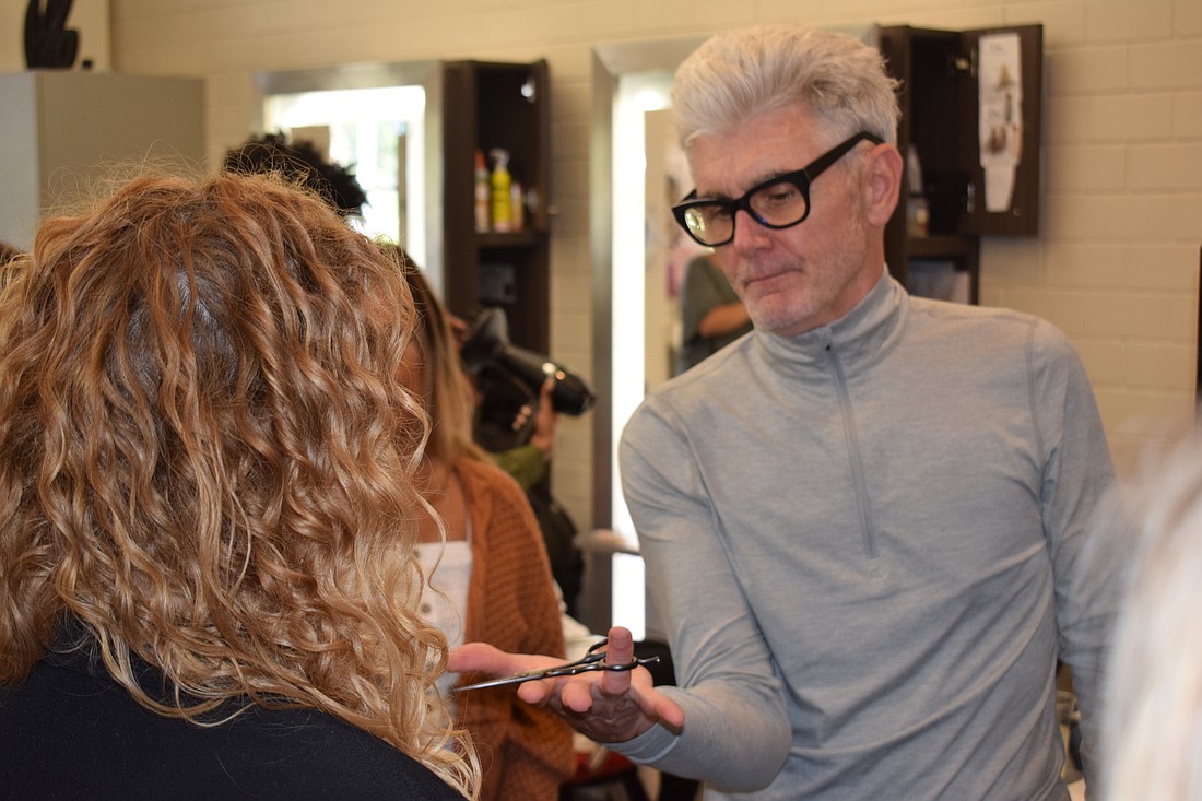 Stephen Moody works with the stylists at Yellow Strawberry.