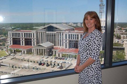 Executive Suite Professionals co-founder Lisa Gufford in one of the company's office suites at EverBank Center that has a view of the Duval County Courthouse. About 85 percent of ESP's tenants are attorneys, small law firms and legal services companies,