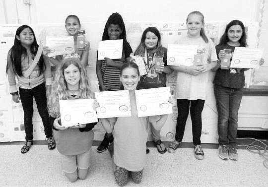 2017 Law Week poster contest winners show off their certificates of achievement.