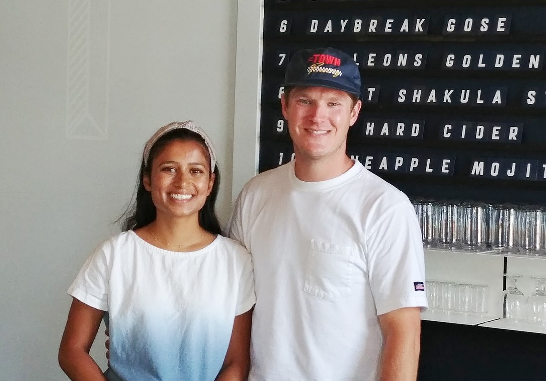 Priya and Alex Moldovan own Town Beer Co. in Murray Hill. The business sells locally brewed craft beer and naturally produced wines.