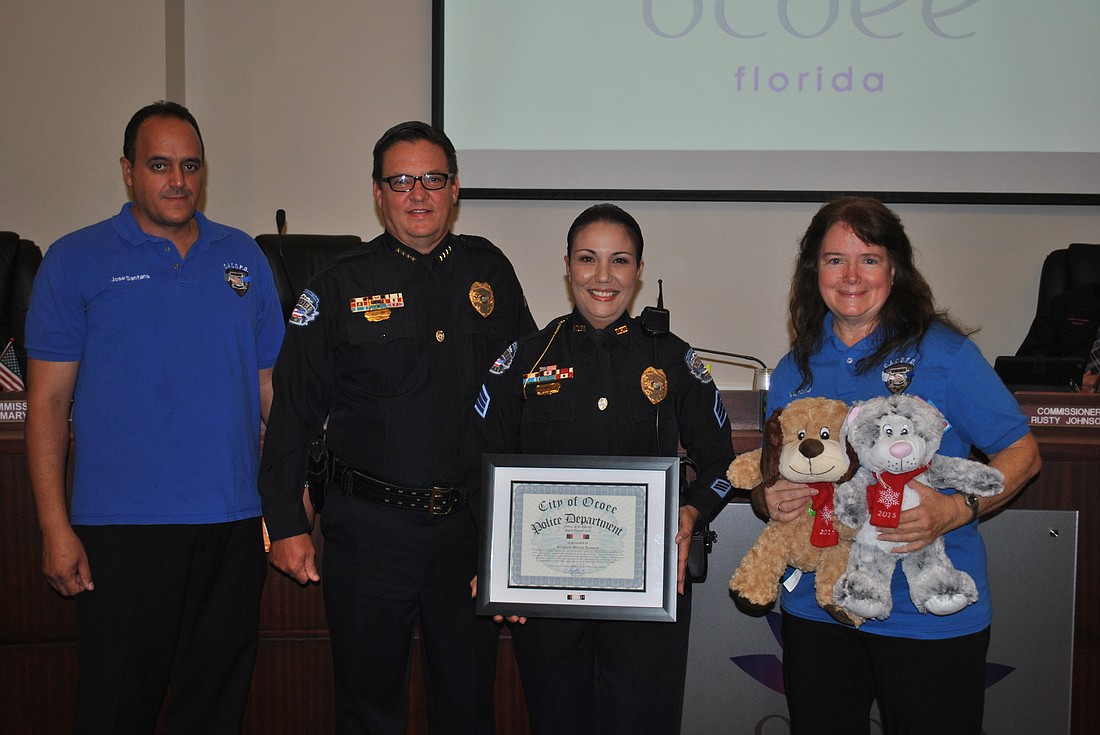Sgt. Mireya Iannuzzi, second from right, is Ocoee Police Officer of the Quarter.