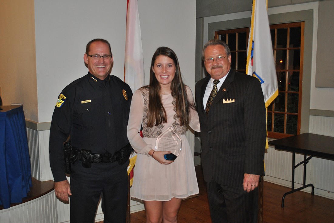 Town officials honored Julia Strube for performing CPR on a fallen jogger.