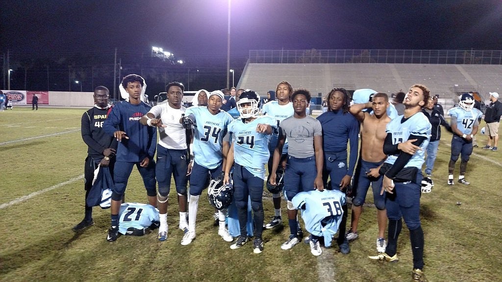 Dr. Phillips players gather for a picture after their playoff loss to Osceola.