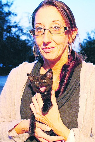 Jessica Bredbenner decided to keep the kitten that she rescued after it was thrown from a moving vehicle.