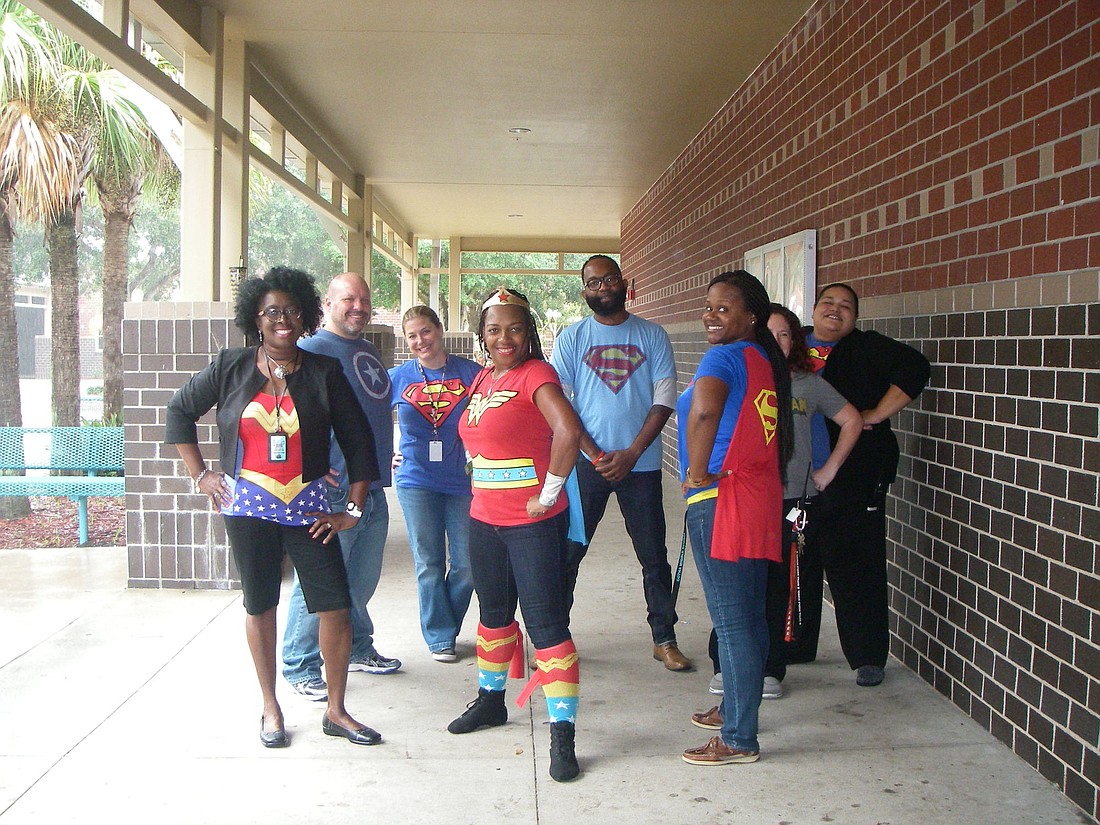 Staff at Gotha Middle School dressed as superheroes to raise awareness of drug issues for Red Ribbon Week.