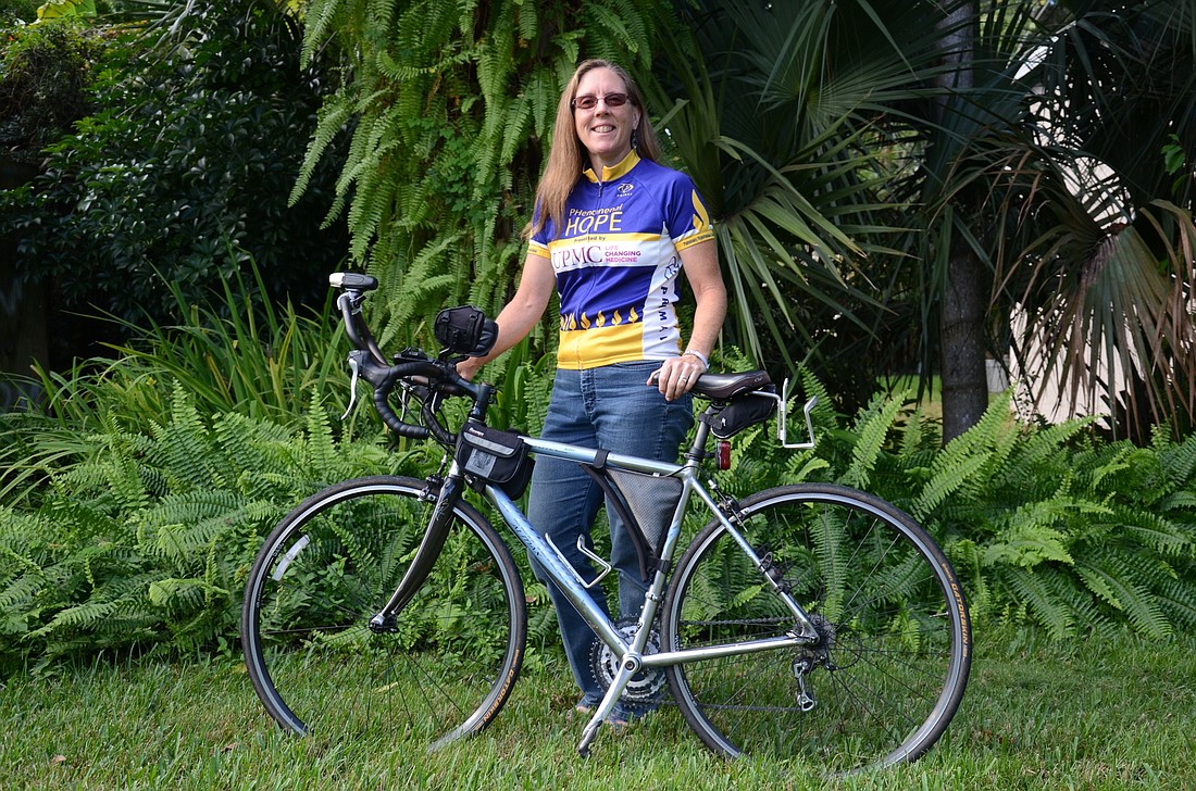 Despite her illness, Kathleen Richardson enjoys riding her bike.