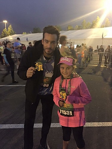 Diaz and Julia sported their finisher medals in this photo, which thousands saw around the world.