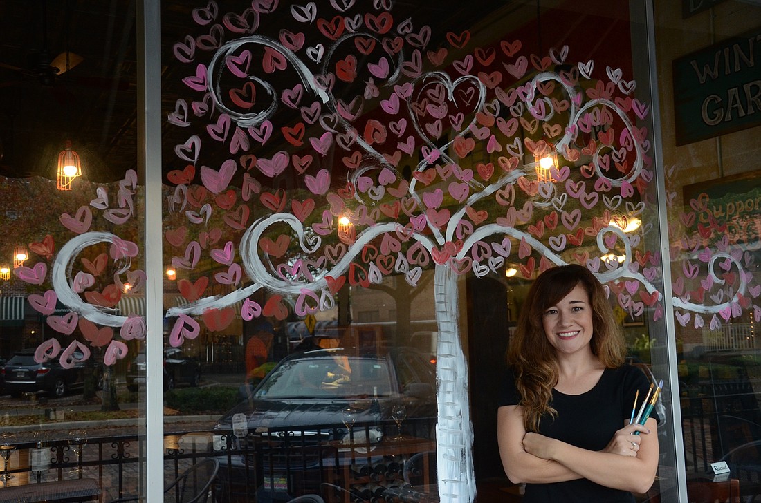 Mindy Hungerford painted the windows of Winter Garden Pizza Company for Valentineâ€™s Day.