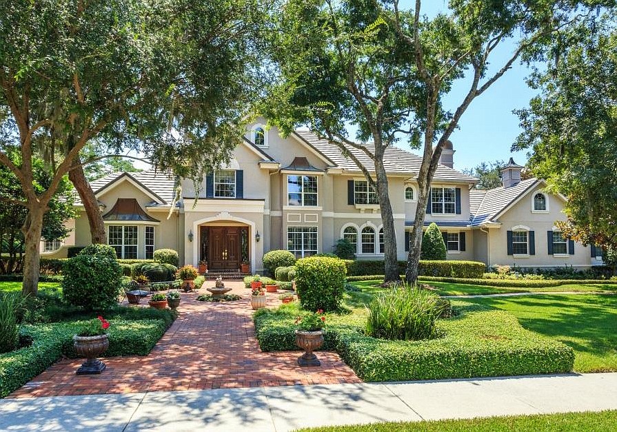 This Cypress Point home, at 8801 Lake Sheen Court, Orlando, sold Jan. 18, for $1.075 million. French doors open to a 62-foot screened and covered porch, which spans the entire rear of the home and overlooks the 50-foot sport pool.