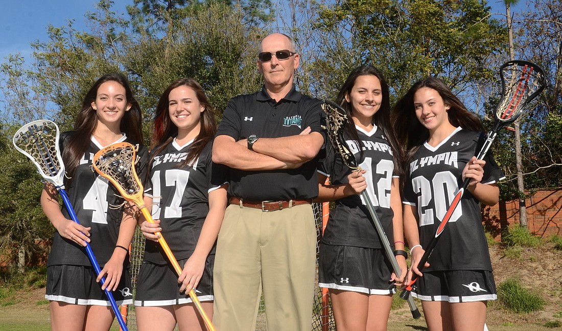 Olympia girls lacrosse seniors Ashley Matthews, left, Jenna Kuka, Kimberly Goic and Brittney Matthews â€” along with longtime assistant-turned-head coach Chip Carbiener â€” are hopeful the Titans can get back to the FHSAA Final Four this spring.