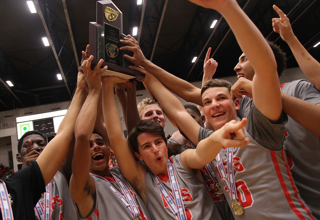 The Lakers were jubilant after winning the FHSAA Class 3A State Championship Feb. 25. Photo by Mike Eng.