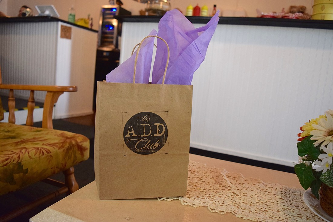 The wine each month is wrapped in tissue paper and hand delivered in a custom A.D.D. Club paper bag.