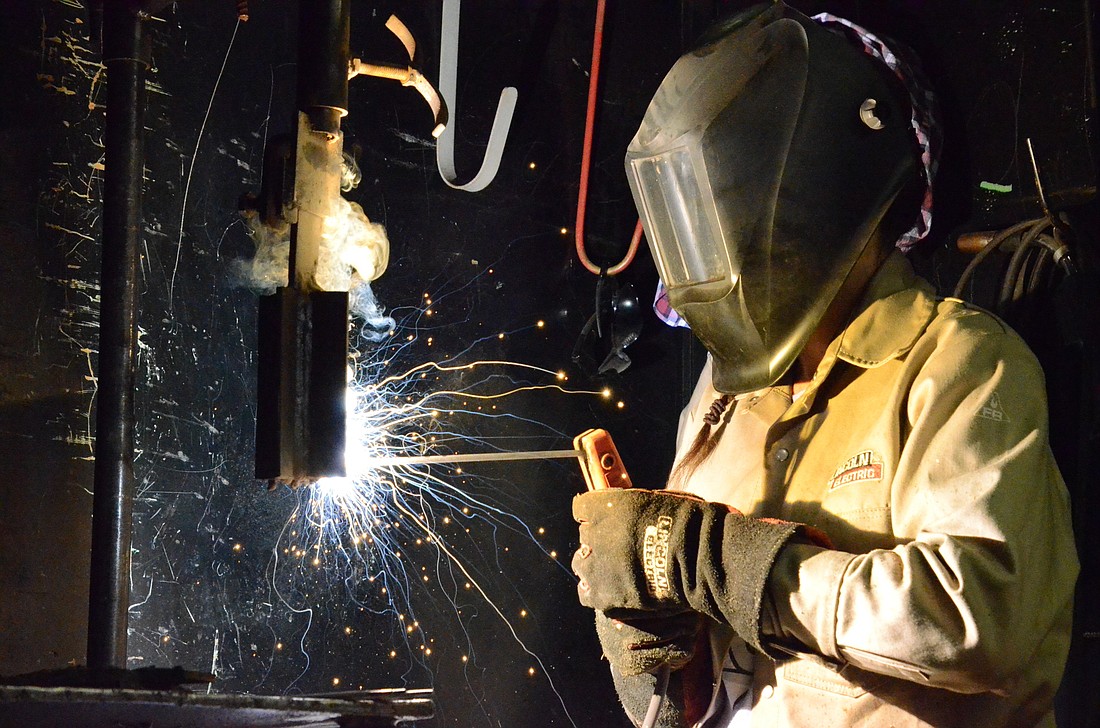 New student Emily Wolcott practices the shielded metal arc welding technique, one of the first taught in Westside College's welding course.