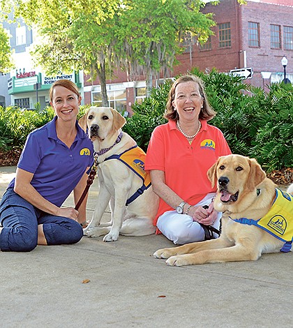 Puppy-raisers teach charges to obey commands so dogs can work as assistance pets